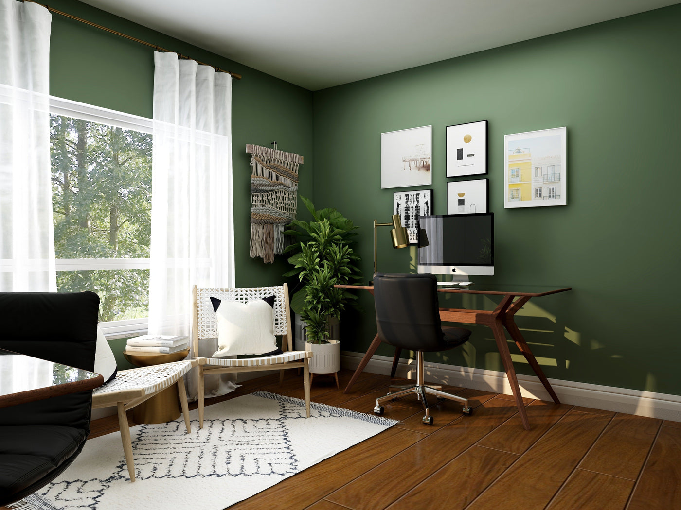 a bright modern home office with green walls, wooden furniture, and framed wall art creating an inspiring workspace